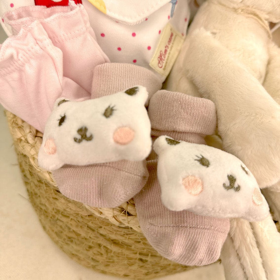 A Luxury Baby Hamper and a teddy bear, perfect for newborn baby gifts.
