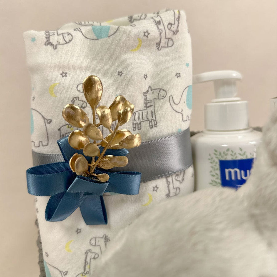 A VWOWGIFTS Hamper with a blue towel and a blue bow.