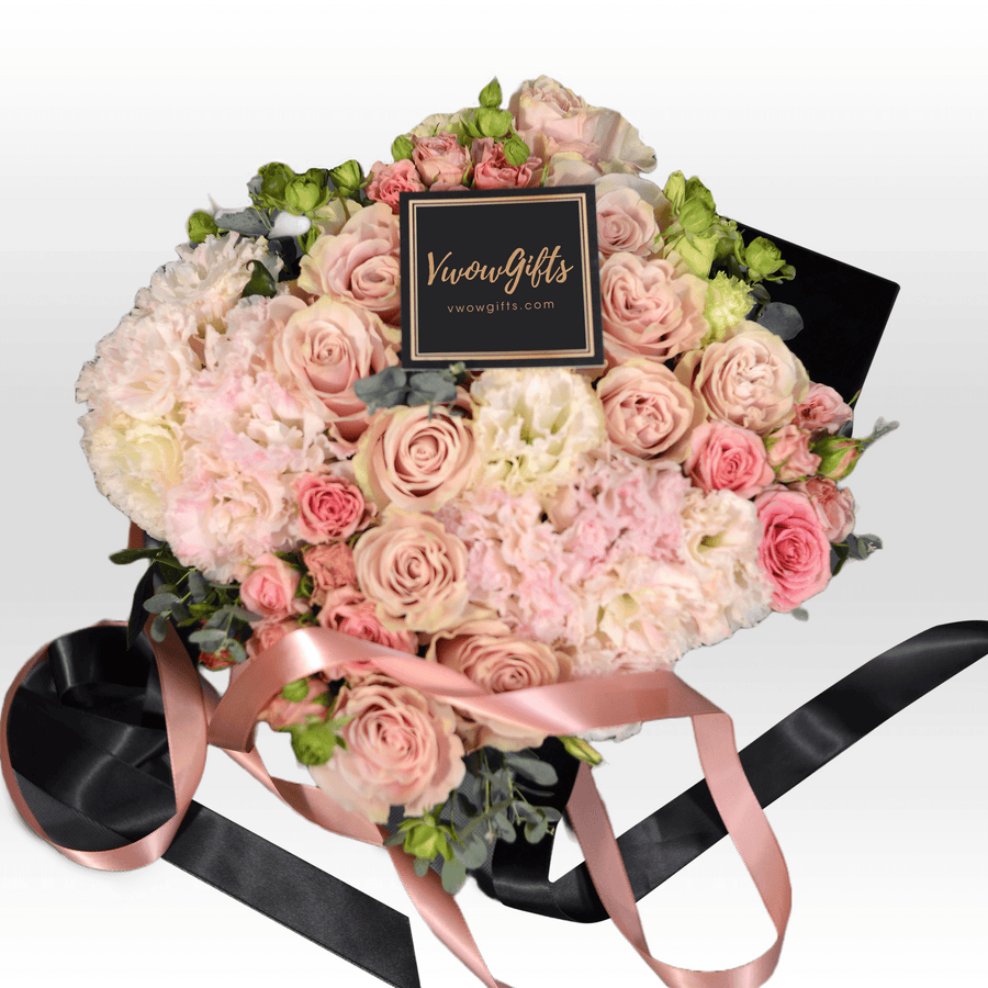 A bouquet of PINK SHADOW flowers with a black ribbon from VWOWGIFTS.