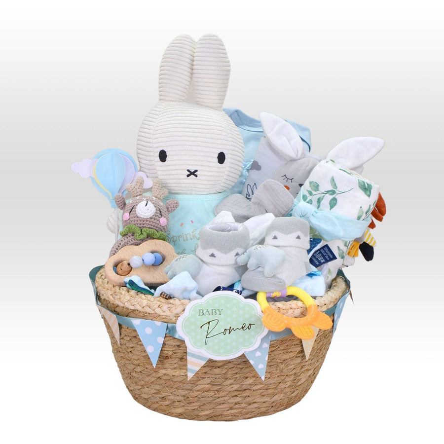A Baby Gifts Newborn basket filled with fun and colorful stuffed animals and a bunny from VWOWGIFTS.