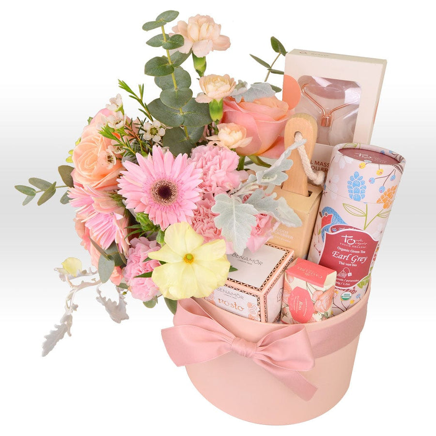 A VWOWGIFTS skincare radiance flower gift box filled with flowers and a bow.