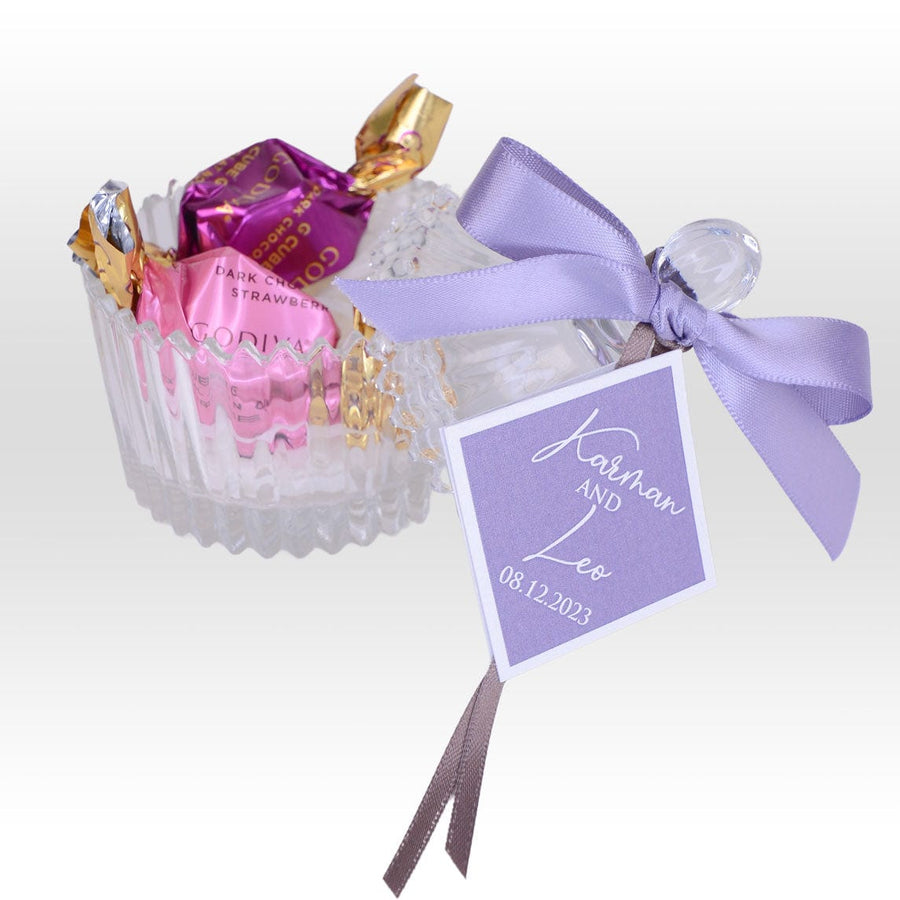 A VWOWGIFTS Sweet Blessing Wedding Favour with Crystal Glassware Box filled with chocolates and a ribbon.