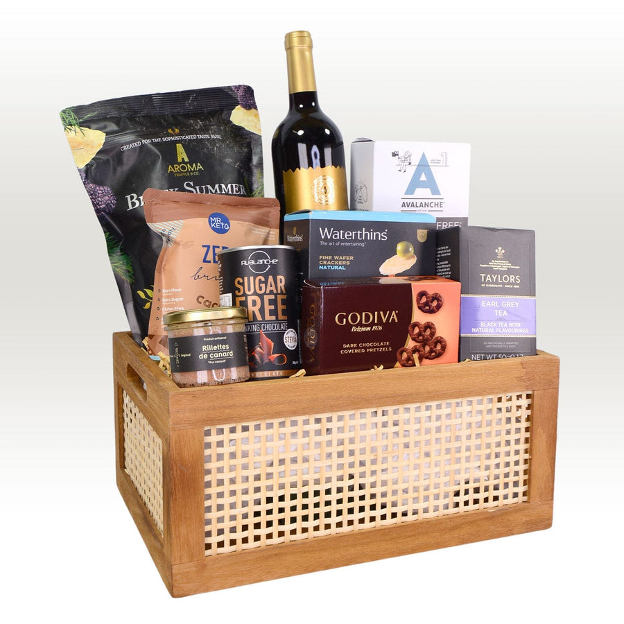 A VWOWGIFTS DELICIOUS TREATS GIFT HAMPER filled with wine, chocolates and snacks.