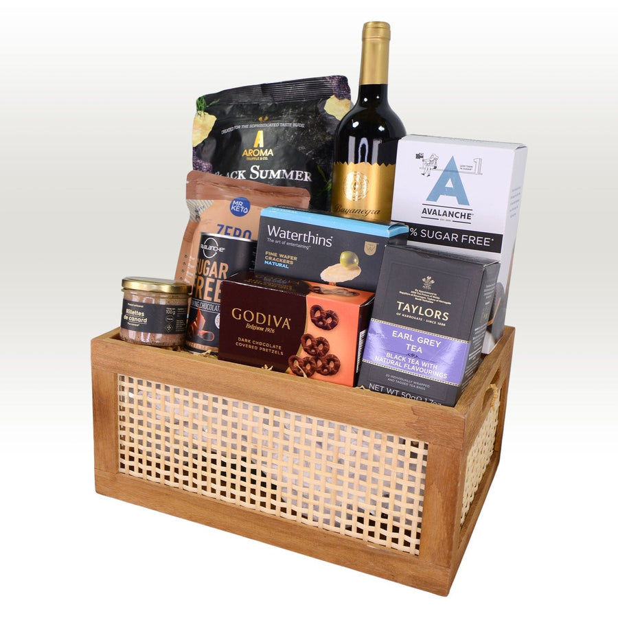 A VWOWGIFTS DELICIOUS TREATS GIFT HAMPER filled with chocolates and wine.