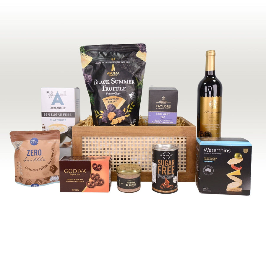 A VWOWGIFTS DELICIOUS TREATS GIFT HAMPER with wine, nuts, and chocolates.