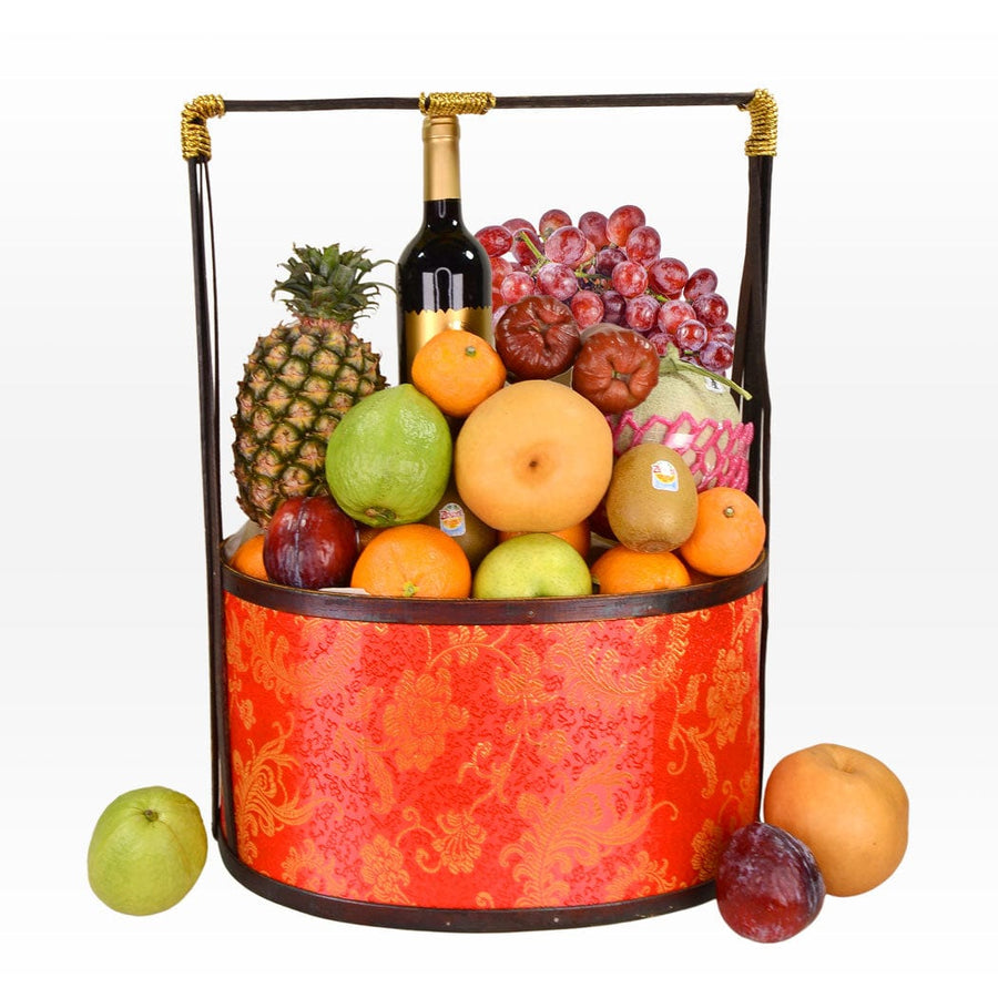 A basket full of UNITY GIFT MID-AUTUMN FRUIT HAMPER YOUR WITH MOONCAKE and a bottle of VWOWGIFTS wine.