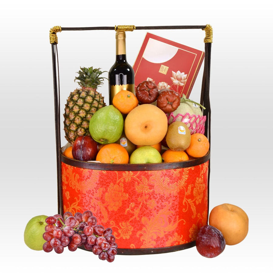A basket full of UNITY GIFT MID-AUTUMN FRUIT HAMPER YOUR WITH MOONCAKE and a bottle of wine by VWOWGIFTS.