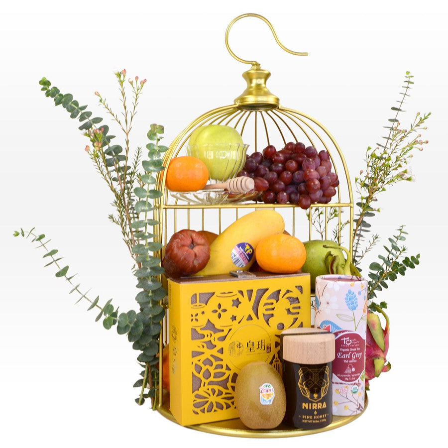 A VWOWGIFTS SILVER MOONLIGHT MID AUTUMN FRUIT HAMPER WITH IMPERIAL PATISSERIE MOONCAKE filled with fruit.