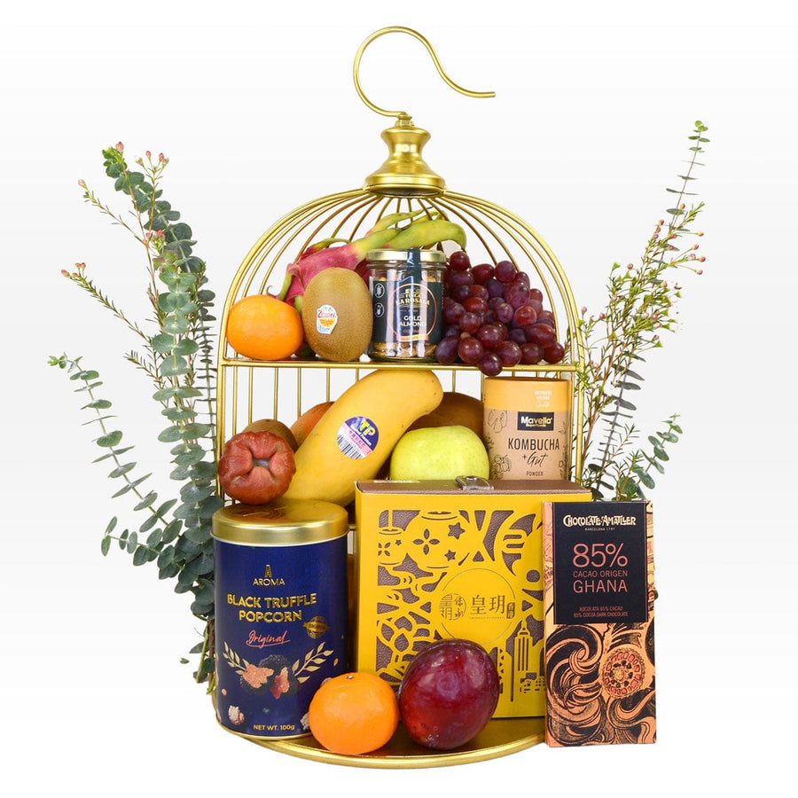 A VWOWGIFTS ENCHANTING MOONLIGHT MID AUTUMN FRUIT HAMPER WITH IMPERIAL PATISSERIE MOONCAKE filled with fruit and chocolates.