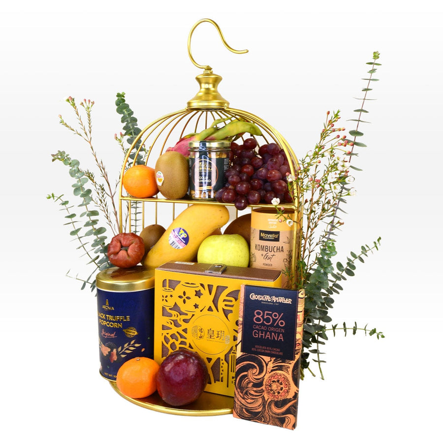 A VWOWGIFTS birdcage filled with ENCHANTING MOONLIGHT MID AUTUMN FRUIT HAMPER WITH IMPERIAL PATISSERIE MOONCAKE fruit and chocolates.