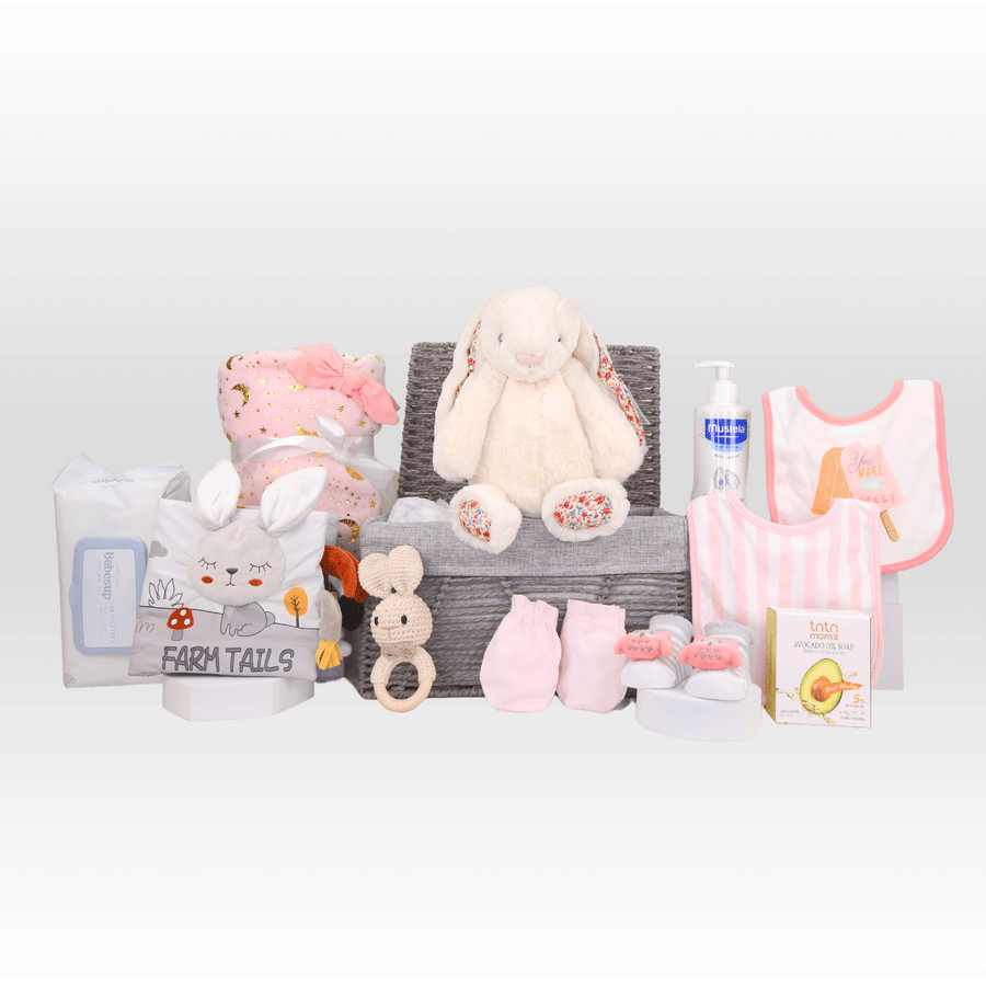 A VWOWGIFTS ULTIMATE BABY HAMPER with a teddy bear and other items.
