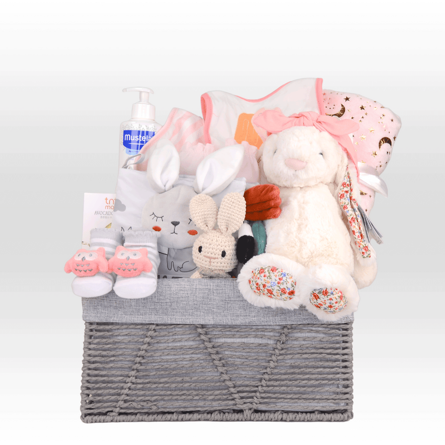 A VWOWGIFTS ULTIMATE BABY HAMPER with stuffed animals and other items.
