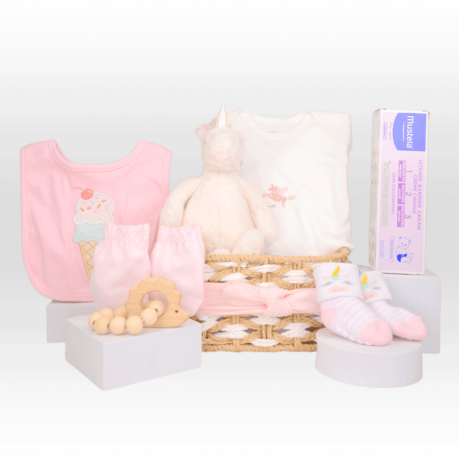 A pink NEWBORN BABY GIFT SET by VWOWGIFTS with a teddy bear, a bib, and a pacifier.
