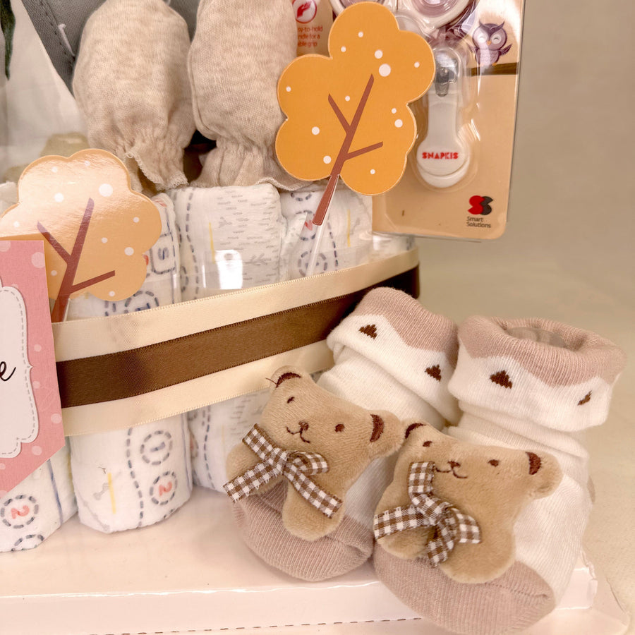 A VWOWGIFTS Sweet Miffy Diaper Cake with teddy bears.