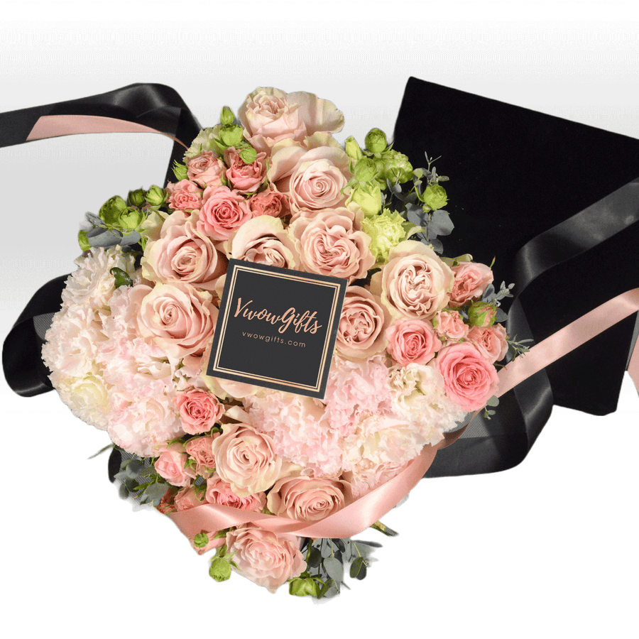 A bouquet of VWOWGIFTS PINK SHADOW roses with a black ribbon.