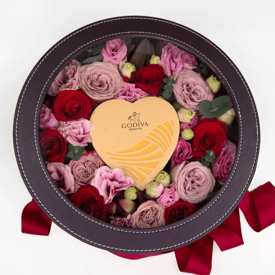 A WHISPERING LOVE heart shaped box filled with roses and chocolate by VWOWGIFTS.
