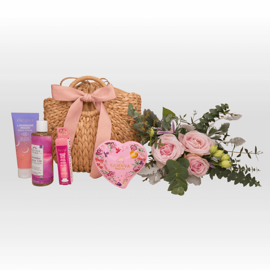 A VWOWGIFTS wicker basket with pink flowers and other items.