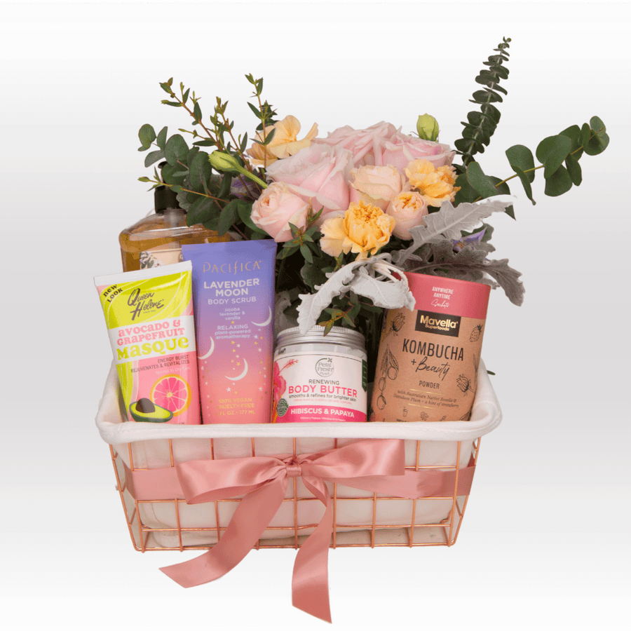A basket filled with various TIMELESS BEAUTY products and flowers from VWOWGIFTS.