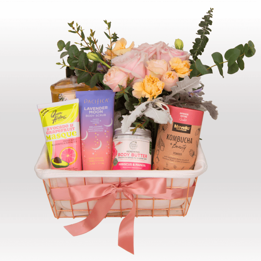 A basket filled with a variety of TIMELESS BEAUTY products and flowers by VWOWGIFTS.