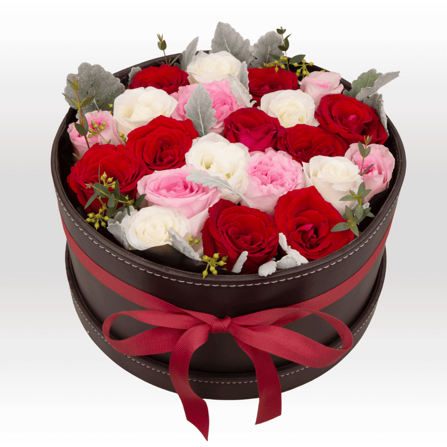 An arrangement of VIVACIOUS FLOWER GIFT BOX roses in a black box by VWOWGIFTS.
