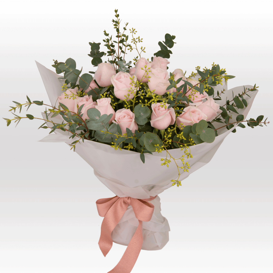 A bouquet of PINK DREAMS roses with eucalyptus and eucalyptus from VWOWGIFTS.