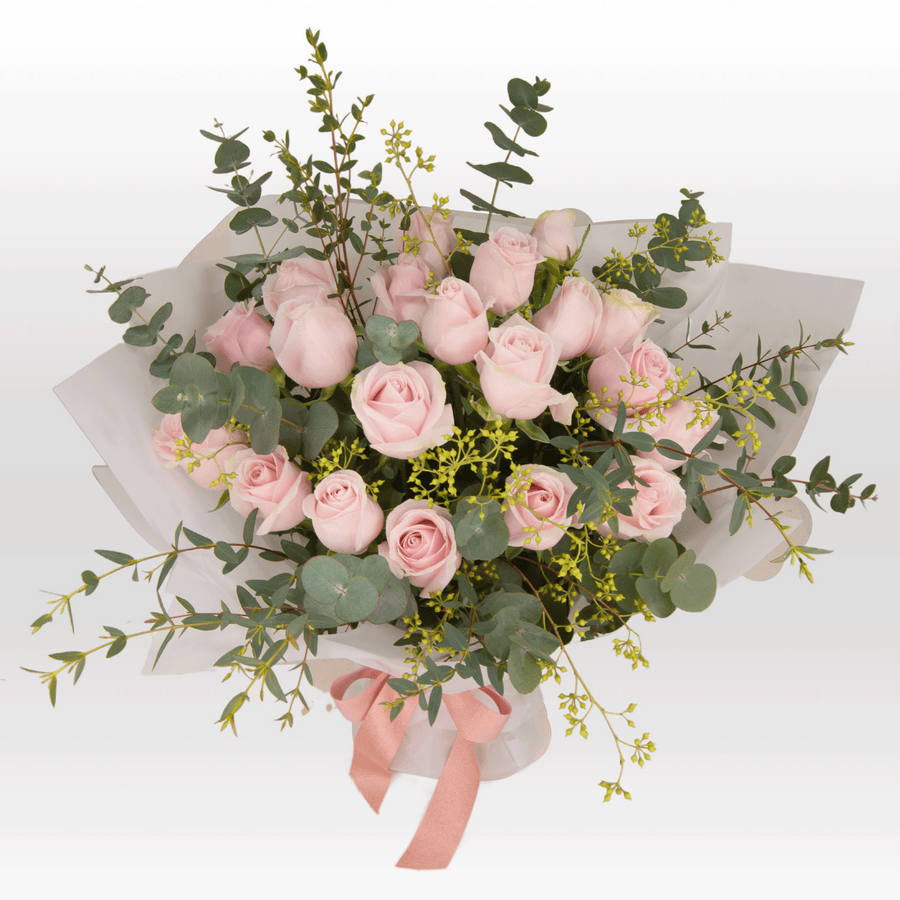 A bouquet of PINK DREAMS roses and eucalyptus by VWOWGIFTS.