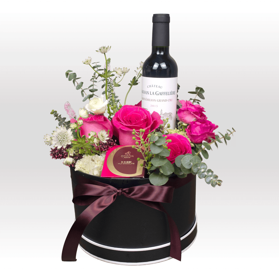 A black box with a SUNRIT FLOWER GIFT SET by VWOWGIFTS, including a bottle of wine and roses.