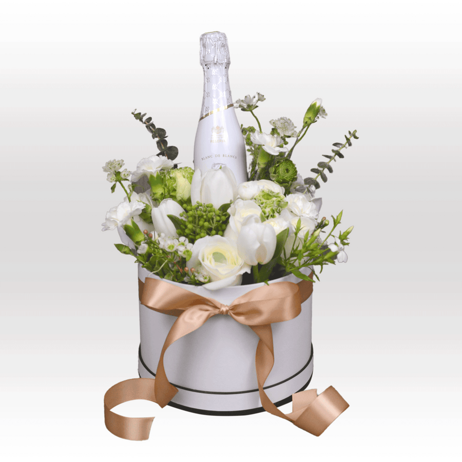 A WINTRY WHITE GIFT BOX SET filled with flowers and a bottle of champagne, by VWOWGIFTS.