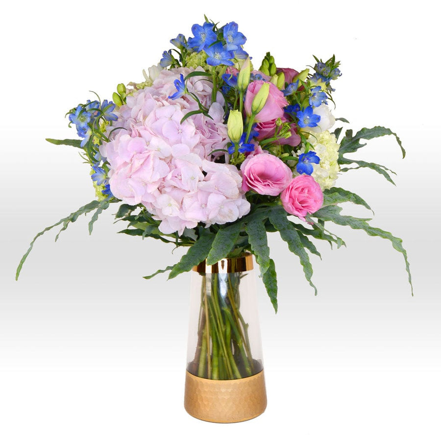 A VWOWGIFTS Vividly Blooming Floral Vase Bouquet of pink and blue flowers in a gold vase.