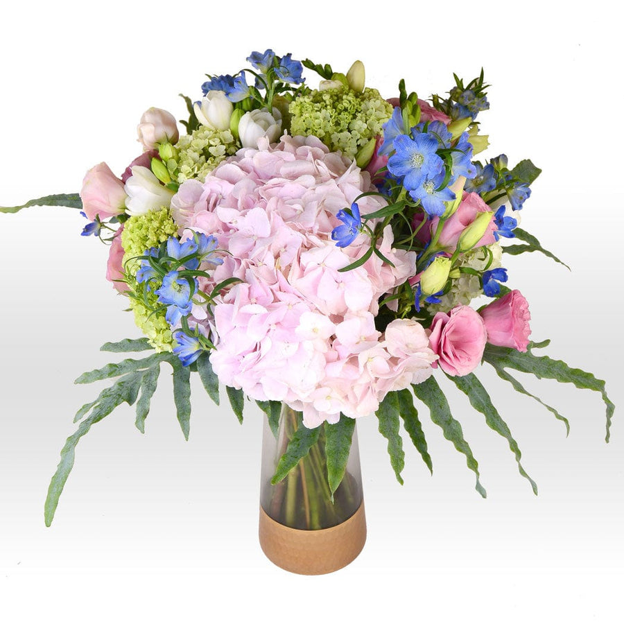 A VIVIDLY BLOOMING FLORAL VASE BOUQUET filled with pink, blue, and green flowers from VWOWGIFTS.