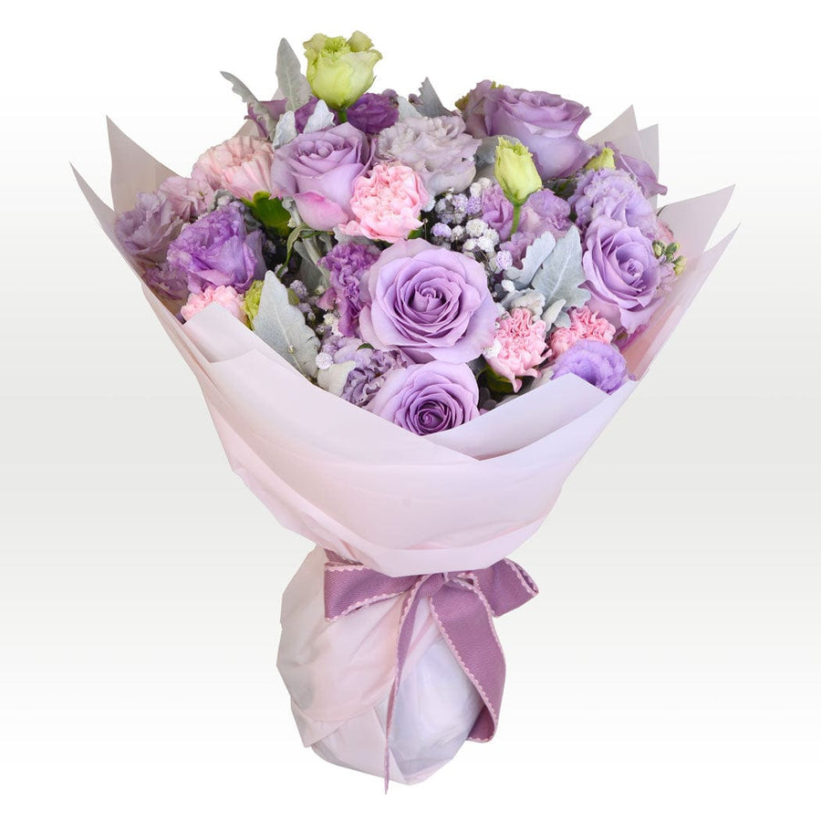 A bouquet of RADIANT BLOOMS TRIO wrapped in white paper by VWOWGIFTS.