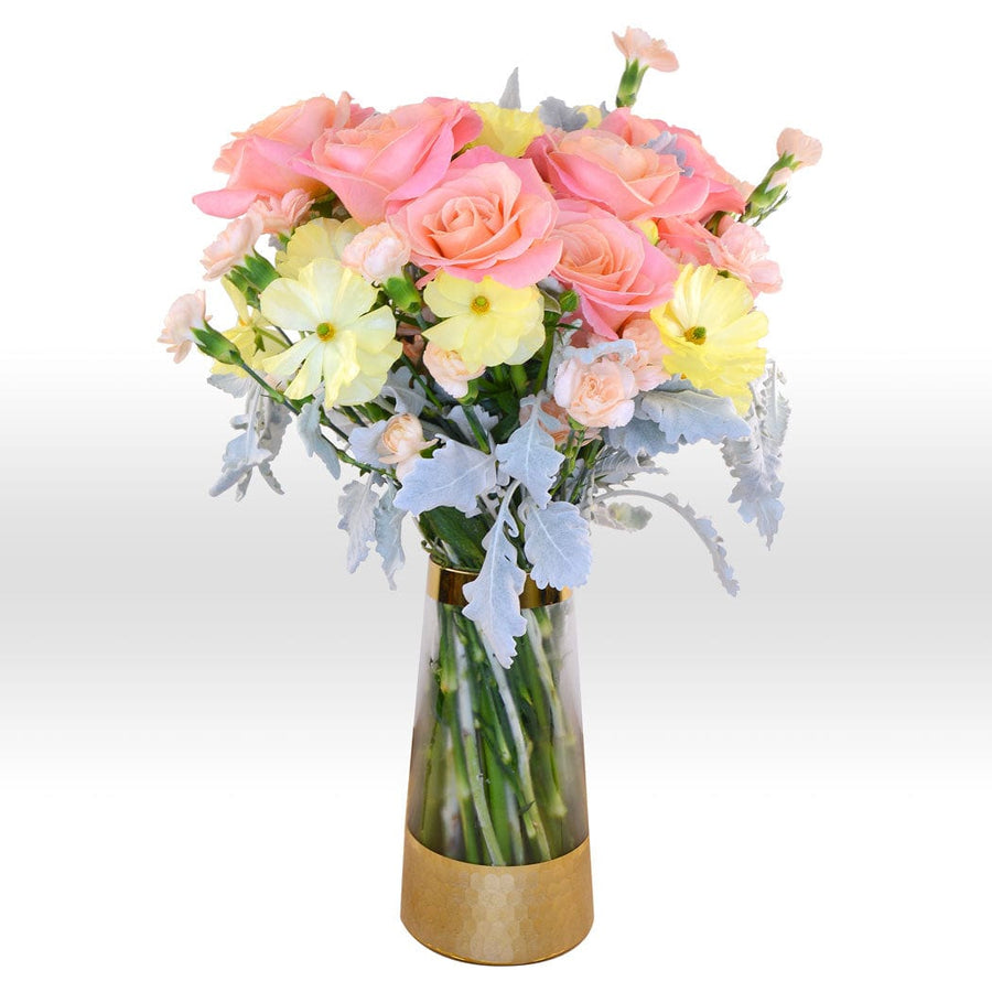 A simply elegant hamper filled with a vase bouquet of pink and yellow roses by VWOWGIFTS.