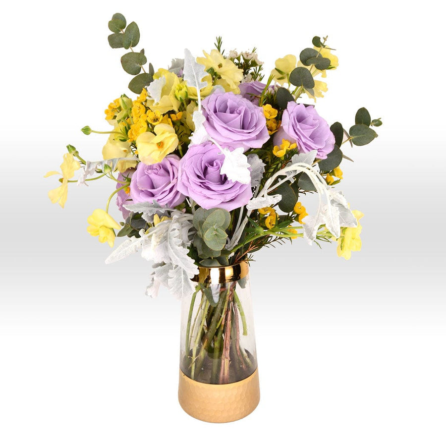 A SERENE FLORAL VASE BOUQUET filled with purple and yellow flowers from VWOWGIFTS.