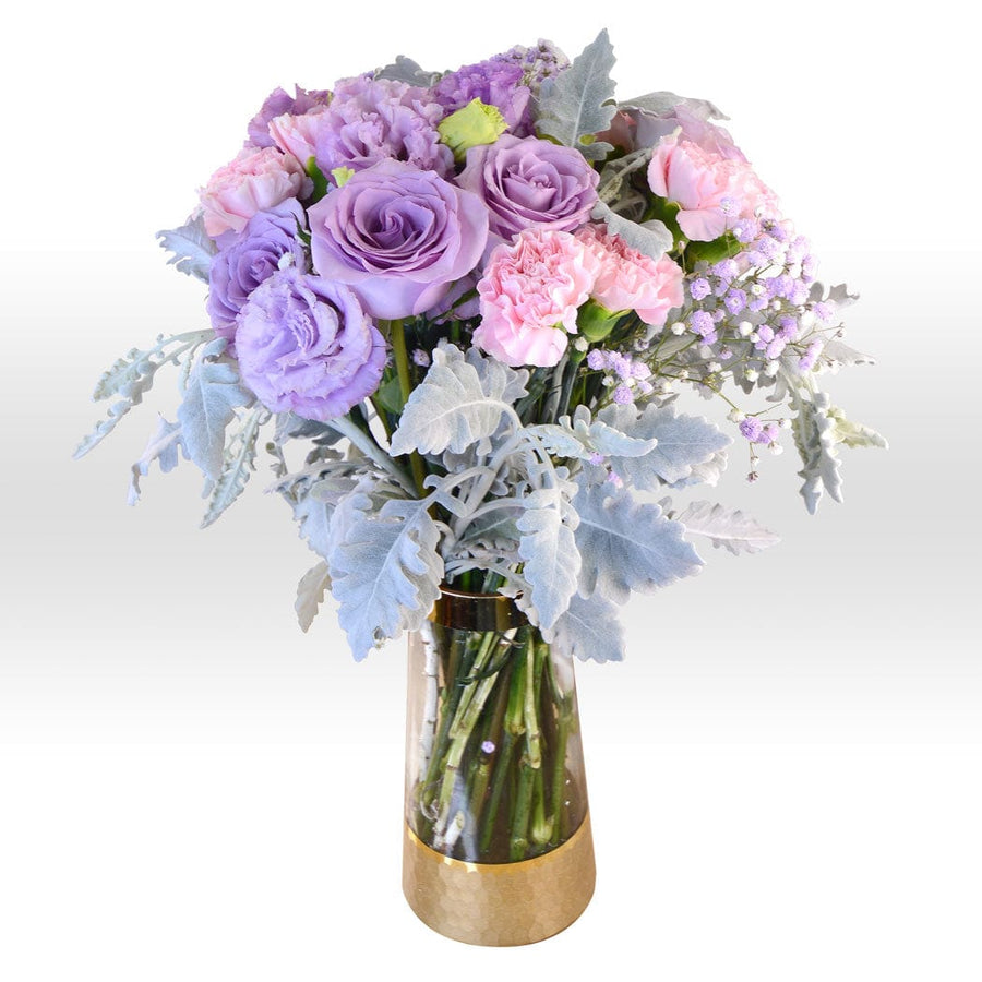 A VWOWGIFTS PURPLE DREAM VASE BOUQUET transformed into a vibrant hamper with purple and pink flowers.