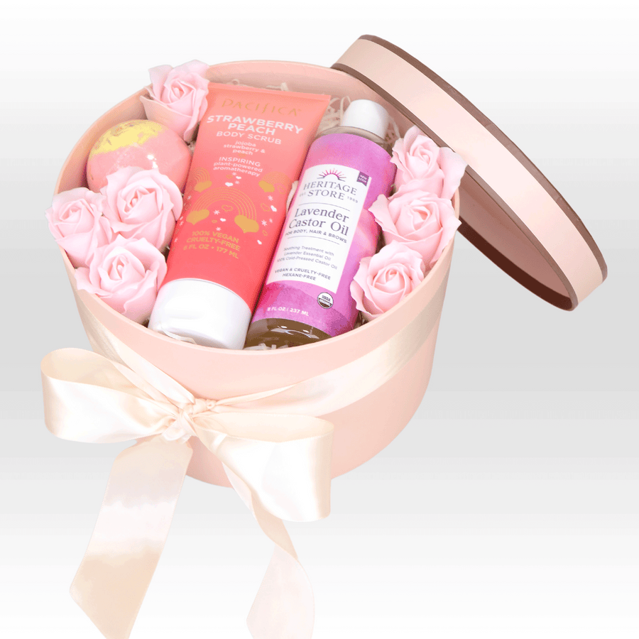 A pink box filled with roses and SELF CARE HAVEN GIFT SET by VWOWGIFTS.