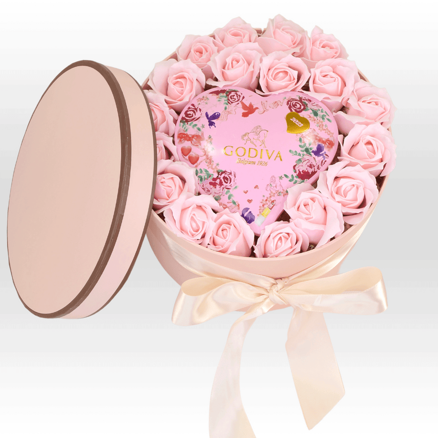 A SWEET SURPRISES heart shaped box filled with roses and chocolate from VWOWGIFTS.