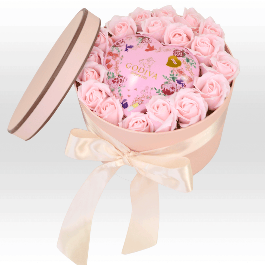 A SWEET SURPRISES heart-shaped box filled with roses from VWOWGIFTS.