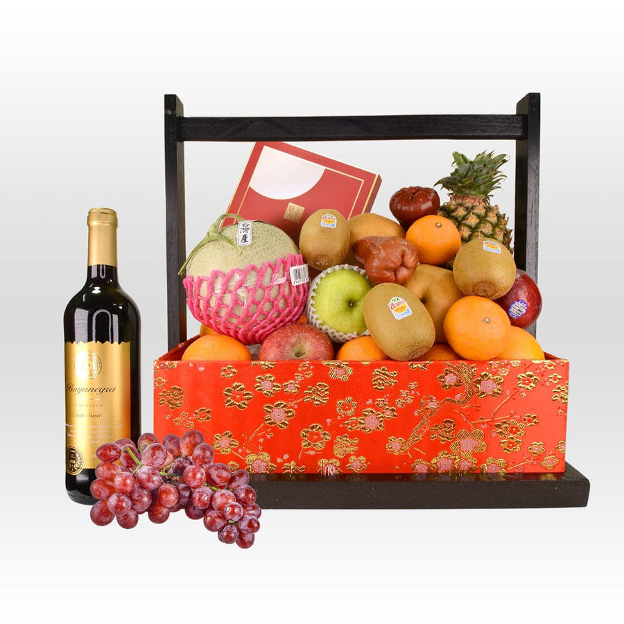 A basket of MOONLIT GATHERING MID-AUTUMN FRUIT WITH MOONCAKE by VWOWGIFTS and a bottle of wine.